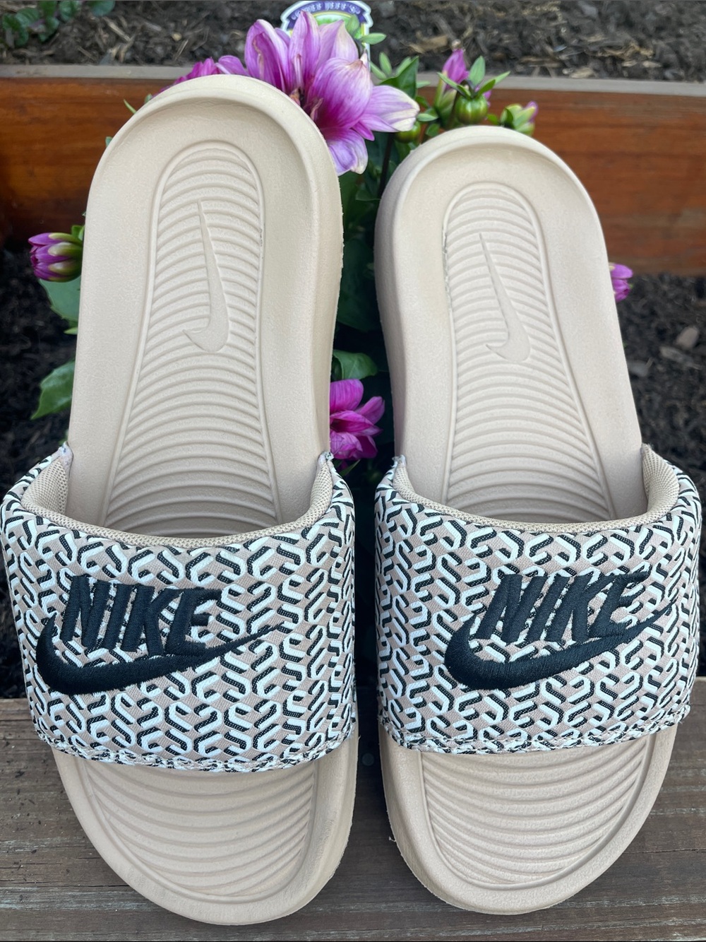 Nike Beige Slide Sandals with Black Embroidered Logo and Patterned Strap
